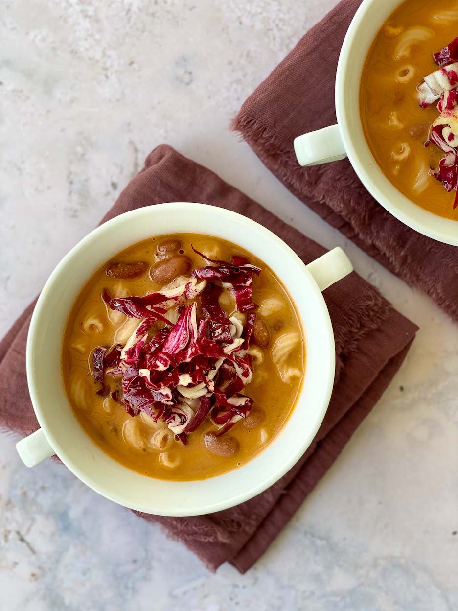 Pasta e Fagioli topped with Radicchio over a purple towel