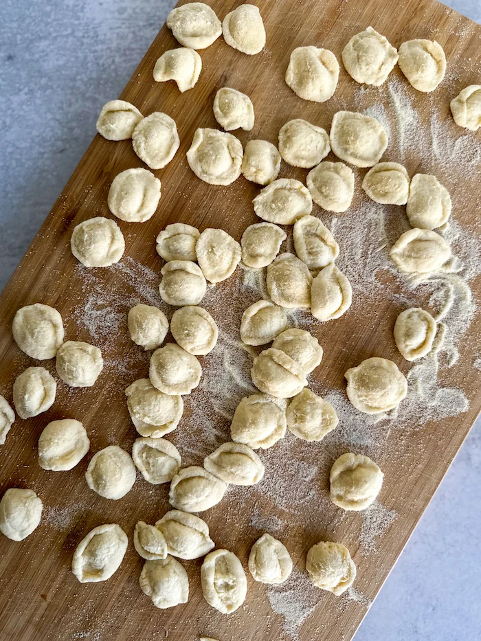 Orecchiette pasta shape on a. wood board