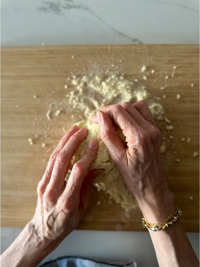 Hands making dough