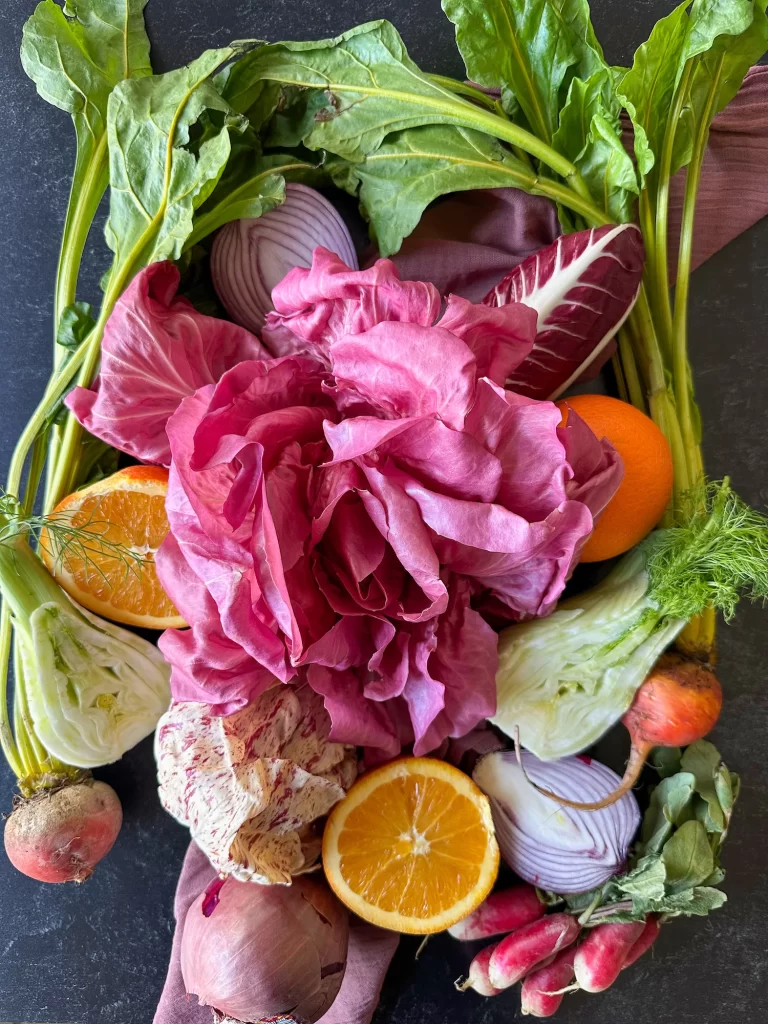 Ingredients to make winter panzanella on a grey table